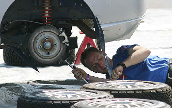 picture of mechanic repairing rear brakes